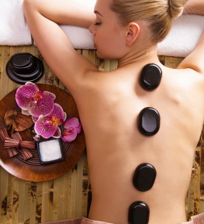 beautiful-woman-relaxing-spa-salon-with-hot-stones-body-beauty-treatment-therapy-less-scaled.jpg
